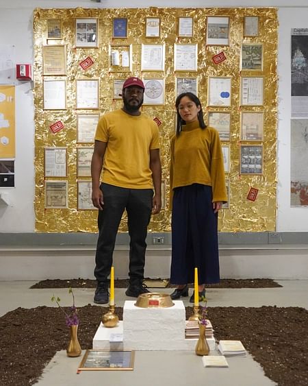 Image of Pin Sangkaeo (right) standing with partner Benson Joseph pictured during their mini-exhibition where proceeds from the exhibition were donated to Thai Rights now. Image taken by Benjamin Wang.