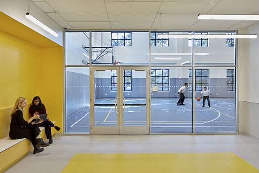 Daylight, colorful accent walls and seating nooks enhance the school interiors. Photo © Ashok Sinha