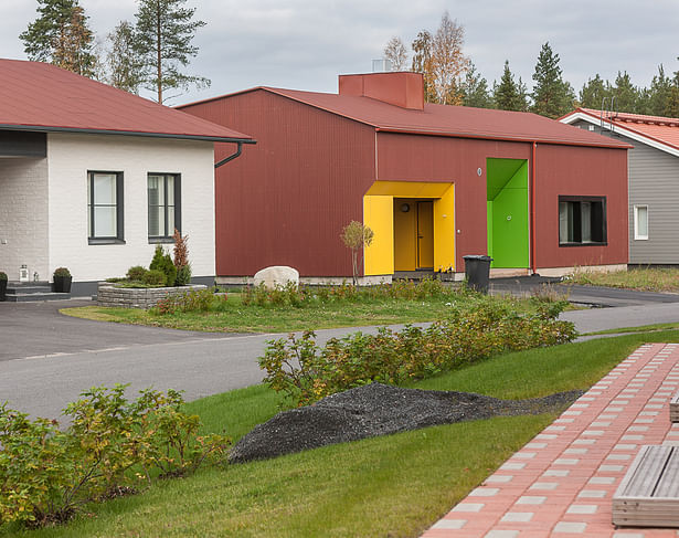 The slope of the roof connects the shape of the building to its surroundings.