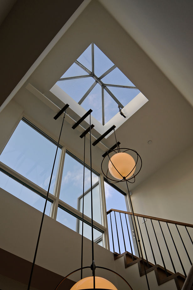 Skylight and wall of glass to bring natural light to lower floors