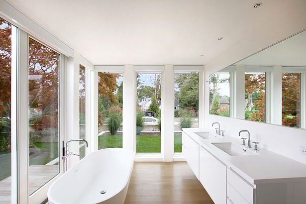 A Soaking Tub in the Master Bath Overlooks an Existing Japanese Maple Tree