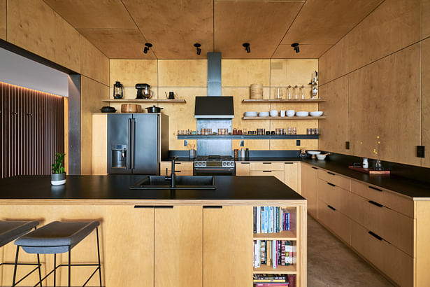 Blackened steel hardware contrasts the light Baltic birch and maple cabinets. Photos by Kes Efstathiou