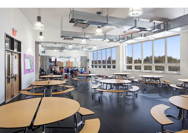 The Multi-Purpose room serves as Cafeteria, Dance, and movement space all with a dynamic view over the treetops.