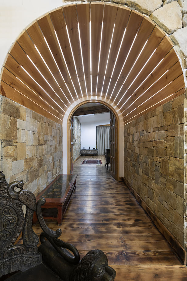 Lit-Barrel tunnel leading towards the bedroom