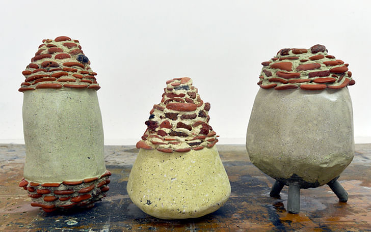 (Above) An image from the video for Bitelli's work 'Faslane's Finest,' made in Clyde, Scotland, which is home to the UK's nuclear fleet. Bitelli created a series of urns (Below) from a cement composed of 'molluscs that encircle the military base filtering leaked radiation and acting as a litmus...