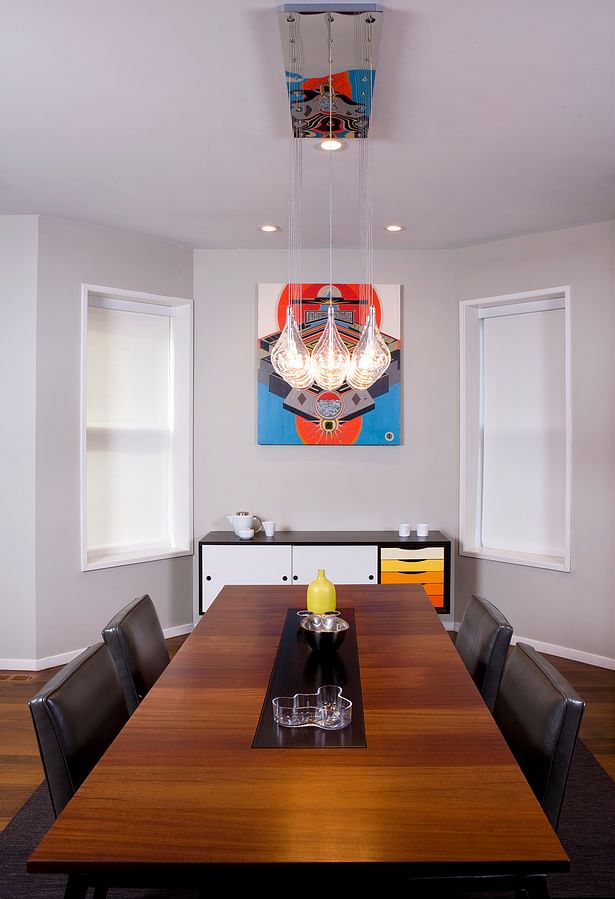 Custom credenza and dining table. Artwork by Henri Preiss.