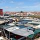 An 'active box' – part community centre, part safe haven – rises above the market of Cape Town's Khayelitsha township. (The Guardian; Photograph: Joy McKinney)