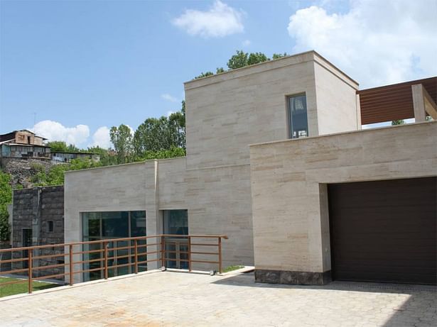 Exterior. Mansion after the reconstruction. The new building for the pool and the garage