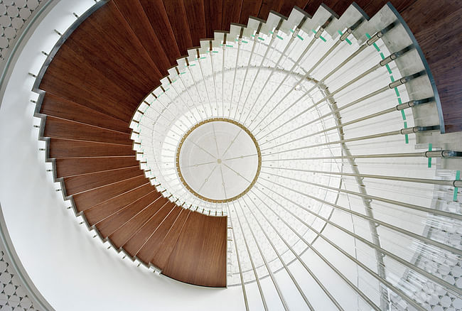 The suspended spiral stair as seen from below. The steps are made of solid bamboo material, and the entire structure is suspended from the ceiling with stainless steel rods. (Photo: Jussi Tiainen)