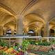 Architect Henry Hornbostel called on the Guastavino Company to design a vaulted arcade below the approach to the Queensboro Bridge, to serve as a public market. Visually, the canopy of tile vaulting transformed a regular grid of columns into a soaring celebration of public space. Photo © Michael Freeman. Courtesy of the Museum of the City of New York 