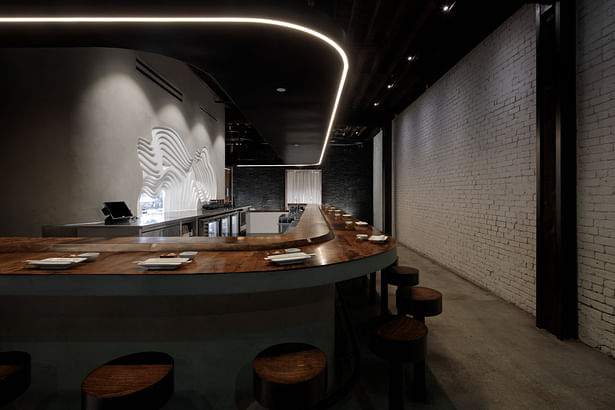 The Temaki Bar, where food is prepared, encompasses the entire space becoming the center focus.