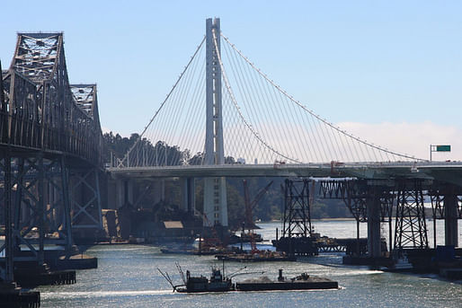 A view of the suspension-bridge section of the East Span of the San Francisco-Oakland Bay Bridge. A replacement for the 1936 original bridge (left in photo), it was designed by a joint venture of T.Y. Lin International and Moffatt & Nicholls Engineers. It will open Sept. 3. Photographer: James S. Russell/Bloomberg