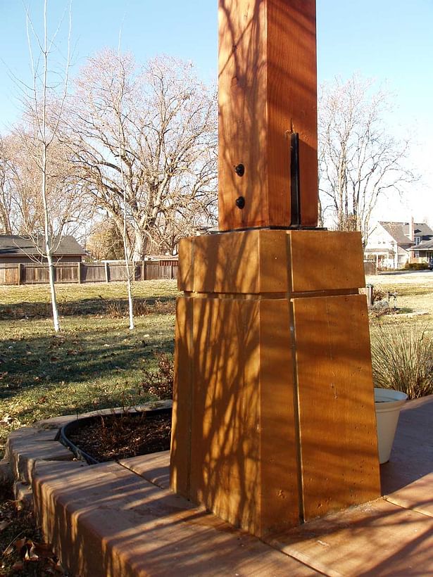 The Heavy timber column and stained concrete base.