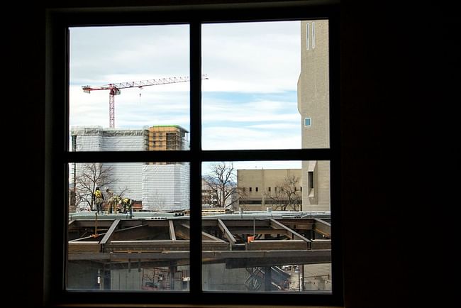 Construction on the Denver Art Museum's north building, seen from inside the Denver Public Library's main branch downtown, Dec. 12, 2018. (Kevin J. Beaty/Denverite)