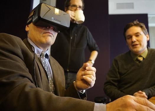 Developer Douglas Boser checked out the virtual reality 3-D visualization of the ReMax Results building that Daniel Stine helped implement for LHB. Photo via startribune.com