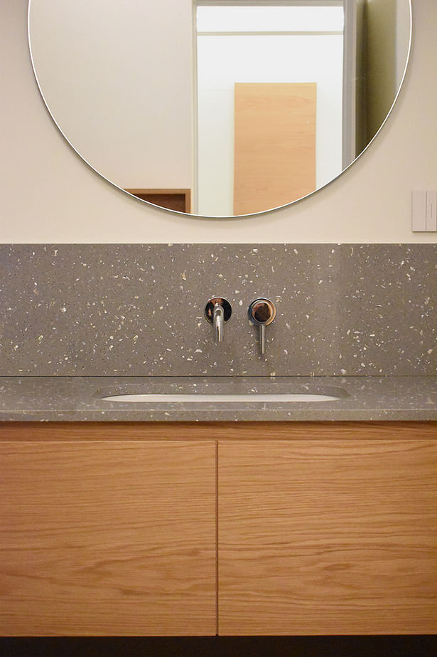 washbasin with quartz stone top and honey oak bespoke furniture 