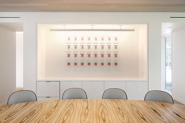 A Corian Sleeve in the Dining Area Makes the Artwork Focal