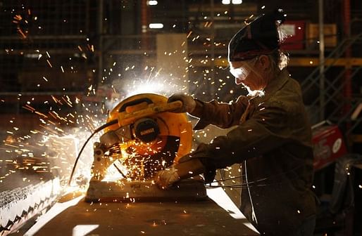 Karen Cusolito, founder of American Steel Studios in Oakland, cuts raw steel for her latest sculpture. Photo: Mike Kepka, The Chronicle 