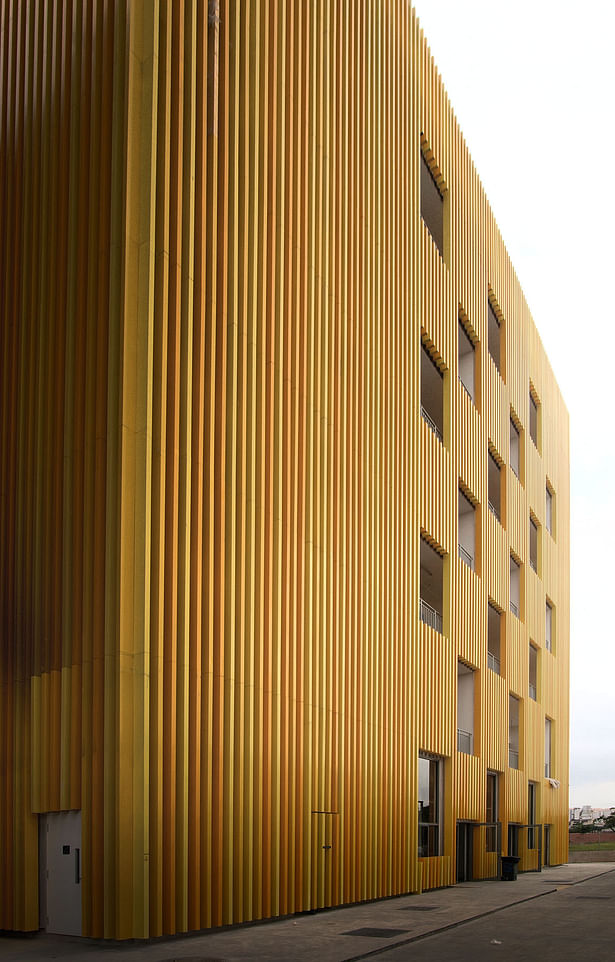 Façade treatment for worker dorms is designed to allow for privacy as well as allow ample natural ventilation into the spaces