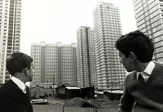 Two boys look at the newly constructed Red Road flats, then the highest in Europe, in November 1967. Photograph: Bob Thomas/Getty. Image via theguardian.com.