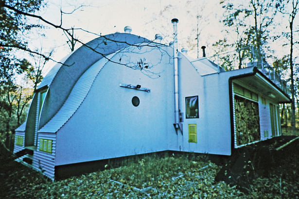 East side of the house with a small Fresnel lens window that expanded the view to the outside without having to have a large energy wasting window to the north. 