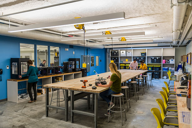 The outfitted makerspace provides areas dedicated to 3D printing, laser cutting, sewing, and material storage in addition to open work stations. Photo credit: Peter Vanderwarker