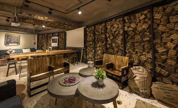 Wood, concrete, and stones serve as main material for the lounge area.