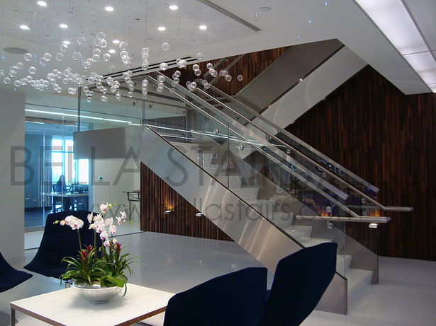 Glass railings & brushed stainless steel elements transform this commercial stair.