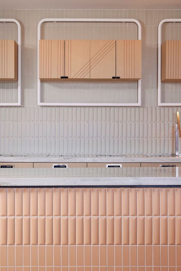 Fluted pastel tiling in the M Club buffet area brings an element of texture in a soft-spoken manner (credit: Noah Webb)
