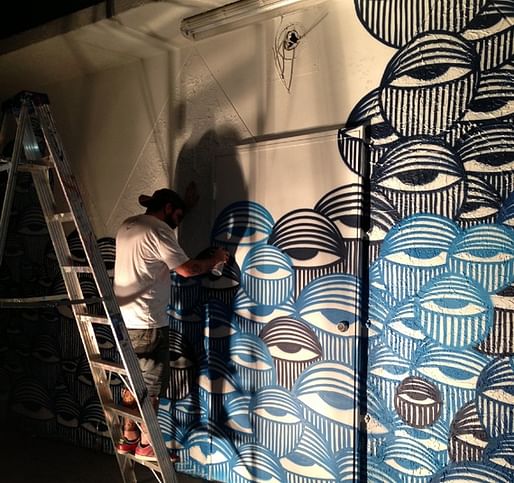 In Miami's Wynwood Arts District, David Anasagasti works on his 'Ocean Grown' mural, a mural at the center of a copyright infringement dispute with American Eagle Outfitters. (via The Atlantic)