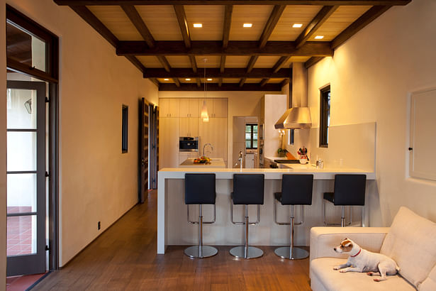 While the kitchen is modern in design and conveniences, it complements the overall aesthetic of the original adobe house. 