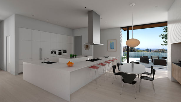 The kitchen and informal dining area. The full height doors slide all the way open so the dining area connects directly to the pool terrace.