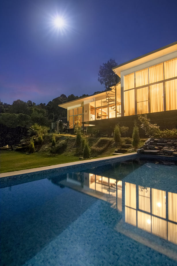 Villa serene overlooking the pool in the evening