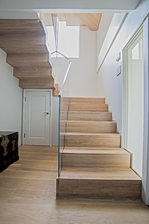 A much needed storage closet was included in the first floor staircase of this town-home to maximize usable space.
