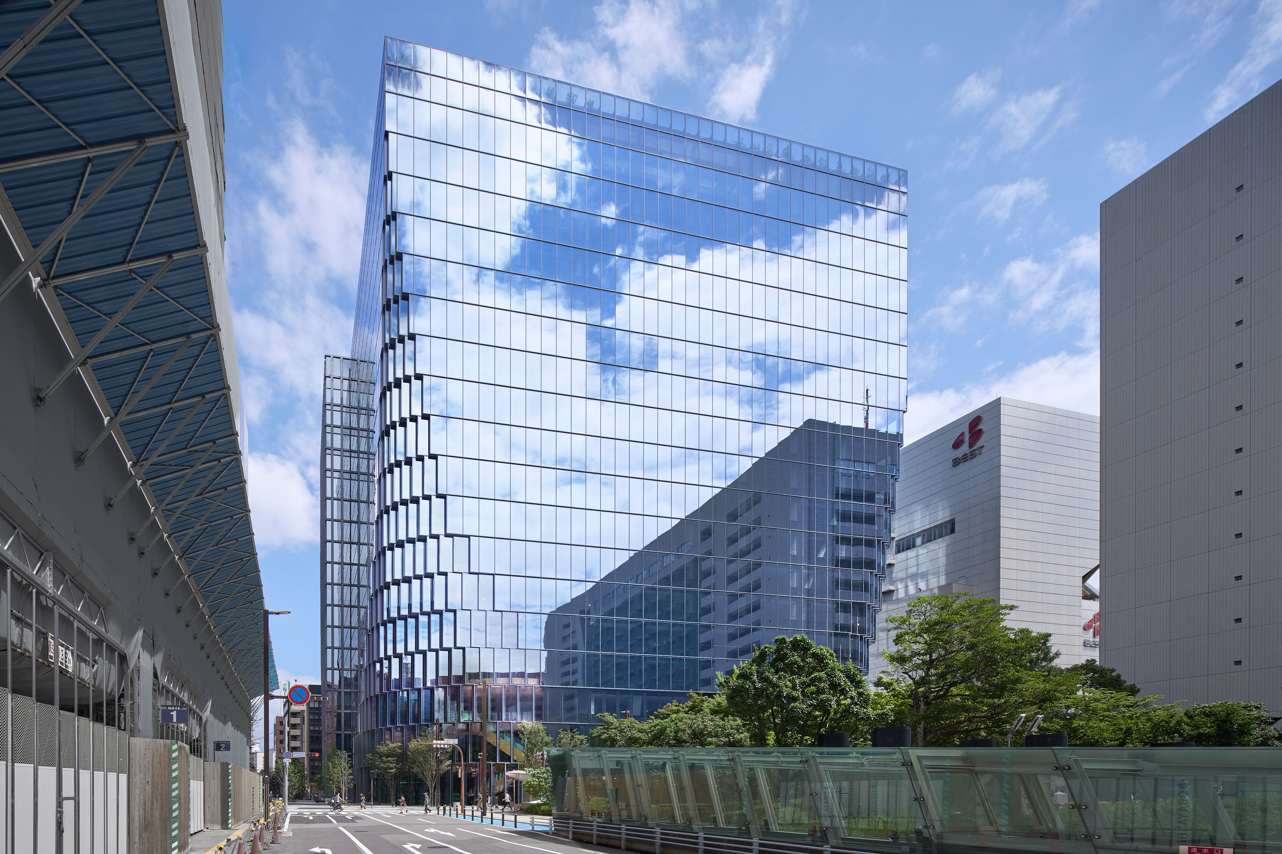 OMA completes Japanese office complex behind staggered glazed facade