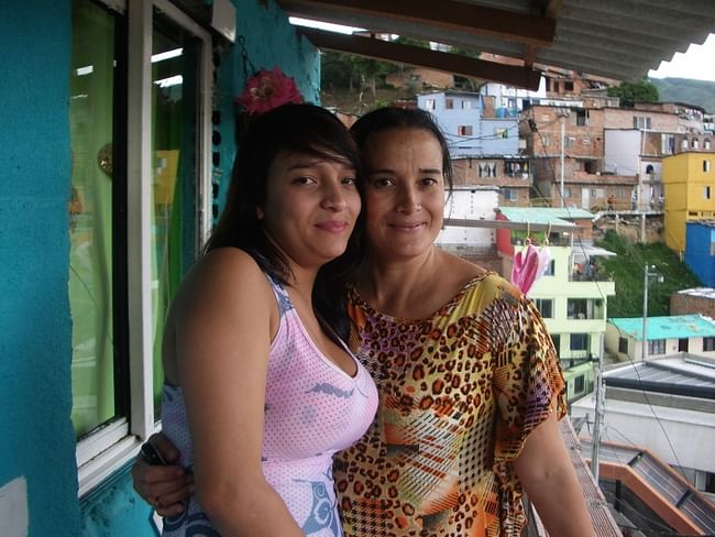 Community leader Adriana Maria Restrepo (right) with her daughter Stefania. “Come back in five years,” Adriana says, “and this neighborhood will have changed from a good neighborhood into a great one!” (Letty Reimerink)