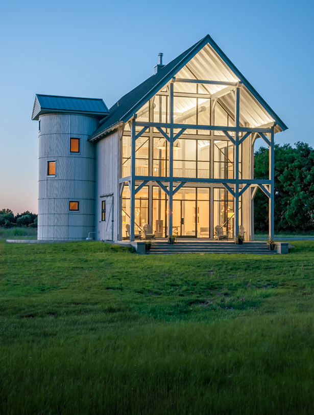 A wall of Hope's windows provides plenty of wow factor for family and friends. The extensive windows also capitalize on natural light and maximize views to the river.