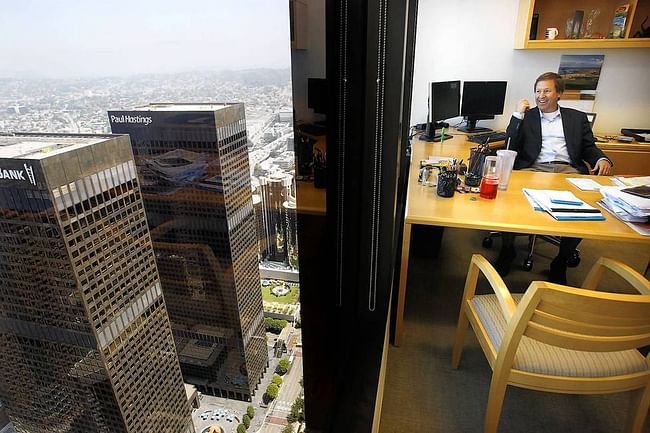 Greg Koltun, managing partner of Morrison & Foerster in L.A., looks out from his office near the top of the Aon Center. The building is the second-tallest in downtown. (Christina House / For the Times)