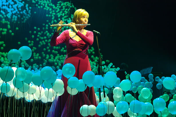 Flutist in meadow