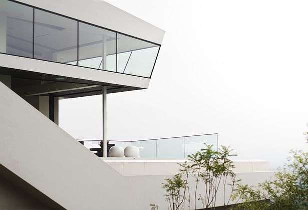 View of pool deck, through and stair extension from below (photo: Arshia Mahmoodi