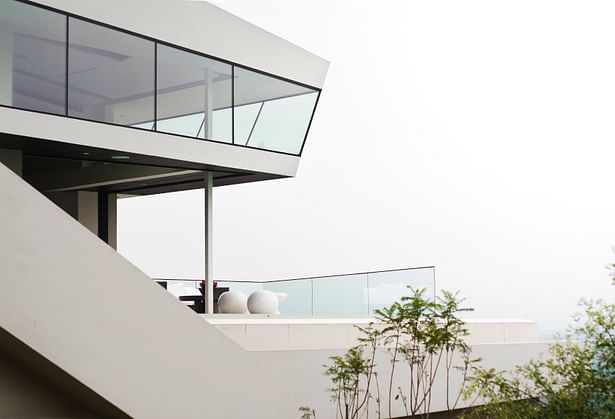 View of pool deck, through and stair extension from below (photo: Arshia Mahmoodi