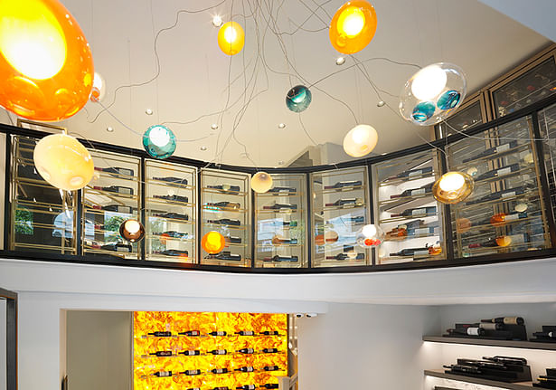 A beautifully organic Bocci chandelier complements the boutique's palette