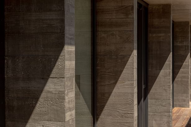 Lake Hayes Home, Queenstown, by Ben Hudson Architects - board-finished concrete fins