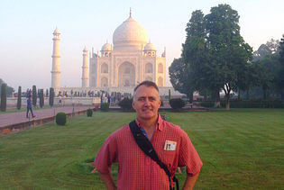 Scott Lee, principal and president of the global architectural firm SB Architects, during a visit to the Taj Mahal in India. (via nytimes.com; Photo: SB Architects)