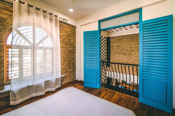 Bedroom with a Balcony overlooking the Courtyard