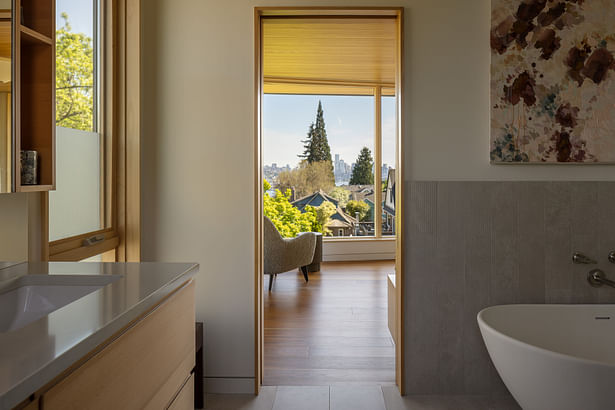 Windows in the main bedroom frame the view of downtown Seattle. Photography: Andrew Pogue Photography