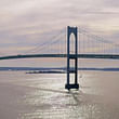 The Pell Bridge measures 2.1 miles across and rises to a peak that stands 400 feet off the water to allow Navy aircraft carriers to pass underneath the roadbed below.