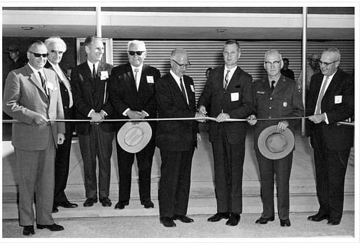 This undated photo provided by the National Park Service shows architect Richard Neutra, second from left, and unidentified others at a ribbon-cuttting at the Petrified Forest National Park visitors compound