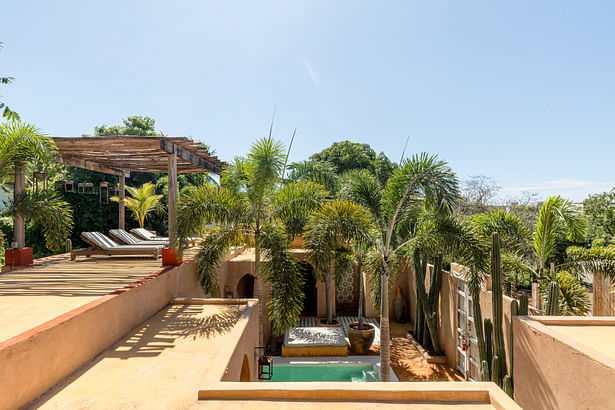 The terrace includes a structure made of local renovated wood and coconut bone