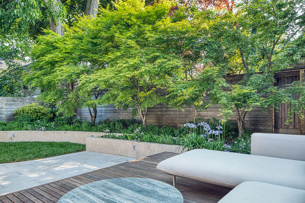 Detail of overlapping concrete retaining walls at deck